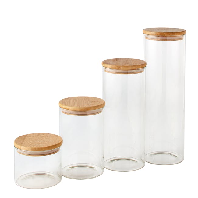 EatNeat Set of 4 Airtight Glass Kitchen Containers with bamboo lids lined from smallest to largerst.
