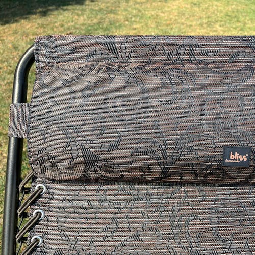 Close-up of the headrest pillow on the 26-inch Brown Jacquard Reclining Sling Chair.