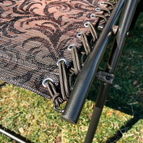Close-up of the bungees on the 26-inch Brown Jacquard Reclining Sling Chair.
