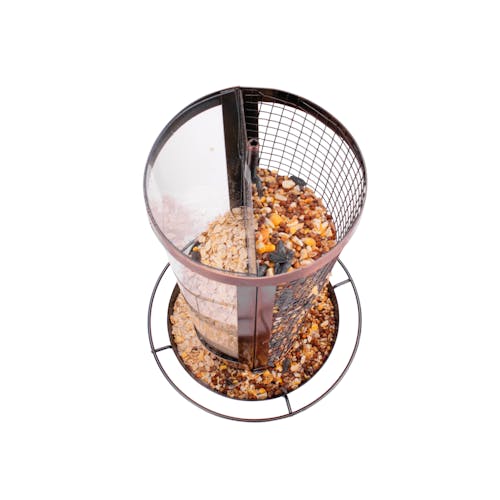 View inside the Bliss Outdoors 2-in-1 Hanging Bird Feeder filled with bird seed.