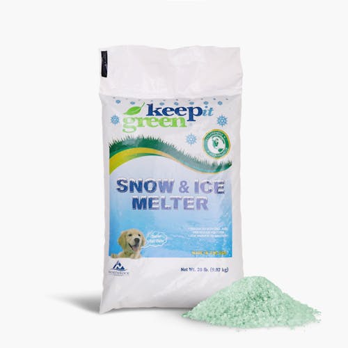 Keep It Green 20 pound page of snow and ice melter with a pile of the melt in front of the bag.