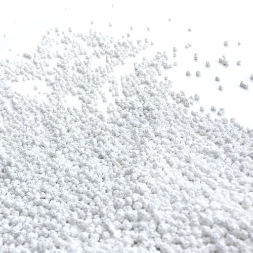 Close-up of the Snow Joe Pure Calcium Chloride Ice Melt Pellets.