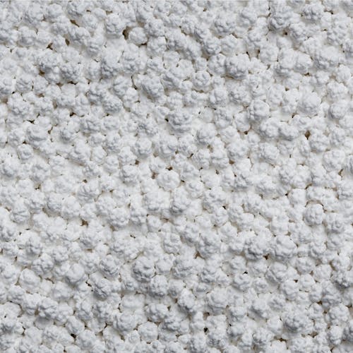 Close-up of the pellets in the Snow Joe Pure Calcium Chloride Ice Melt.