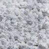Close-up of the Snow Joe Calcium Chloride Pellets Professional Strength Ice Melter.