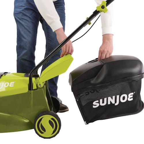 Person attaching the collection bag onto the Sun Joe 24-Volt Cordless 14-inch Lawn Mower.