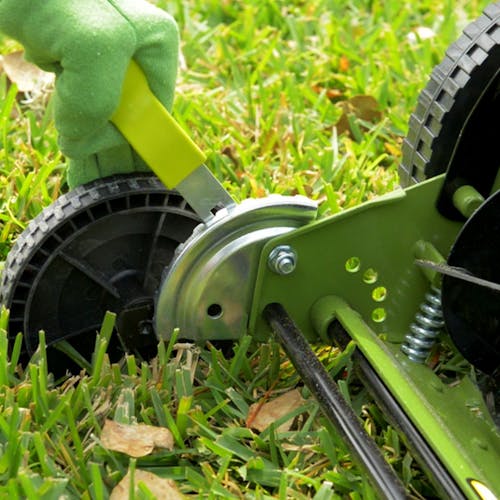 Close-up of the height adjustment lever on the Sun Joe 16-inch manual reel lawn mower.