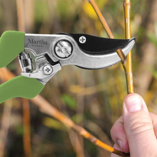 Martha Stewart Carbon Steel Bypass Pruners snipping a small branch.