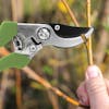 Martha Stewart Carbon Steel Bypass Pruners snipping a small branch.