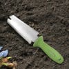 Martha Stewart Hori-Hori Garden Knife laying in soil.