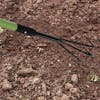 Martha Stewart Telescoping 3-Prong Garden Cultivator clawing through soil.