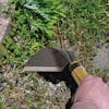 Martha Stewart Wood Handle Garden Hoe being used on plants.