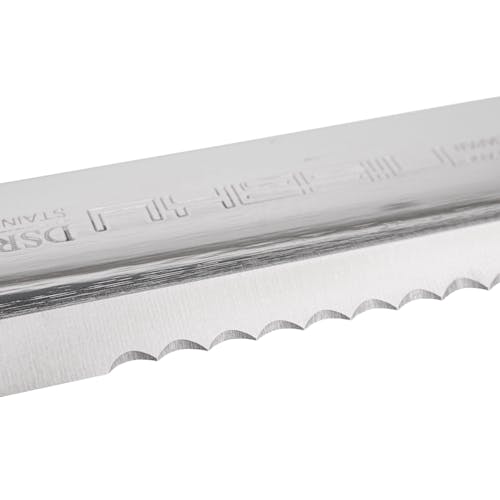 Close-up of the serrated edge on the Nisaku Limited Edition Stainless Steel Weeding Knife.