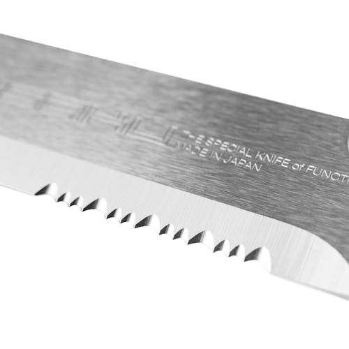Close-up of the serrations on the blade of the Nisaku Rikugatana 7.5-inch Japanese Stainless Steel Knife.
