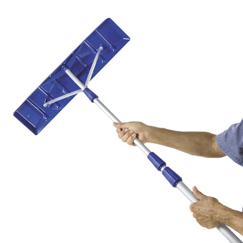 Person holding the Snow Joe 21-foot telescoping snow shovel roof rake.