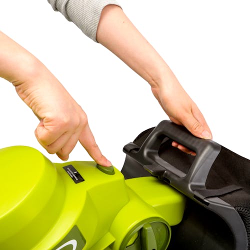 Person pressing the collection bag release button on the Sun Joe 14-amp 8-gallon 3-in-1 Electric Leaf Blower, Vacuum, and Mulcher.