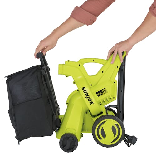 Person attaching the collection bag to the Sun Joe 13-amp 10.6-gallon 2-in-1 Electric Vacuum and Mulcher.