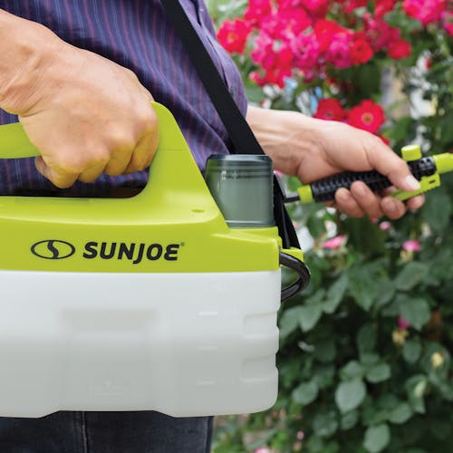 Close-up of the Sun Joe 4-volt 1-gallon Cordless All Purpose Chemical Sprayer being used to spray plants.