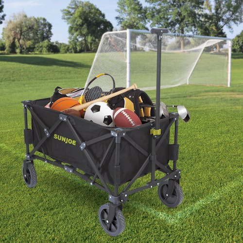 Sun Joe Heavy-Duty Metal Framed Garden Utility Wagon filled with sports balls and equipment.