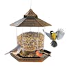 Sun Joe Bronze hexagonal Wild Bird Hanging Feeder filled with food and birds on it.