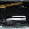 Snow Joe 4-in-1 telescoping snow broom and ice scraper collapsed in the trunk of a car.