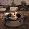 Fire going in the Sun Joe 35-inch Rustic Barrel Cast Stone Base, Wood Burning Fire Pit with the dome screen on top.