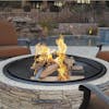 35-inch wood burning fire pit outside with logs buring.