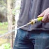 Sun Joe Brass Sweeper Jet Hose Nozzle spraying a pinpoint stream.