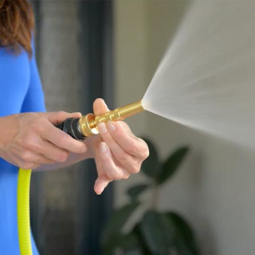 Sun Joe 2-in-1 brass twist hose and jet sweeper nozzle with a fanned spray.