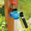 Aqua Joe Multi-Function Outdoor Faucet and Garden Hose Tap Connector attached to a garden hose and spraying water.