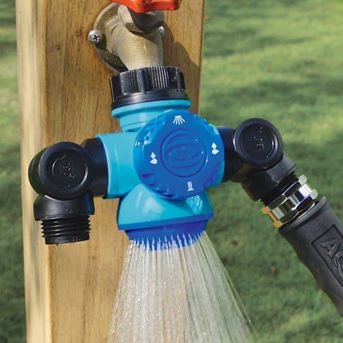 Shower spray setting for the Aqua Joe Multi-Function Outdoor Faucet and Dual Garden Hose Tap Connecter connected to a hose.