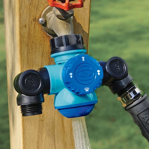 Soaker spray setting for the Aqua Joe Multi-Function Outdoor Faucet and Dual Garden Hose Tap Connecter connected to a hose.