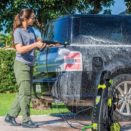 Sun Joe pressure washer detergent being used with a foam cannon to wash a car.