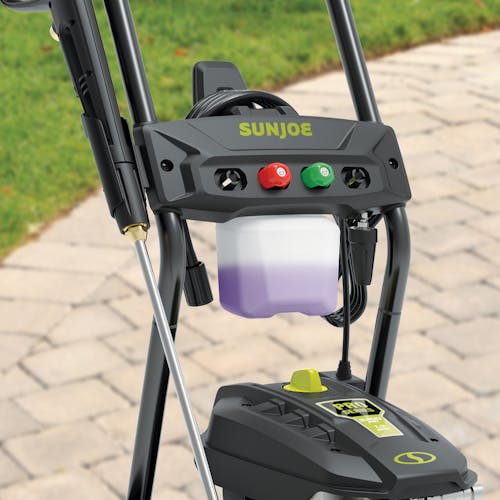 Close-up of the Sun 14.9-amp 3200 PSI High-Performance Brushless Induction Electric Pressure Washer in a driveway.