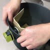 Sun Joe Universal Paper Filter Bag being put in a 8-gallon Wet/Dry Vacuum.