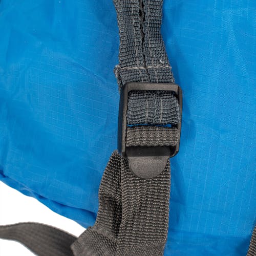 Close-up of the straps on the TrailGear 19-liter waterproof blue backpack.