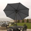 9-foot gray patio umbrella set-up outside over a patio table and chairs.