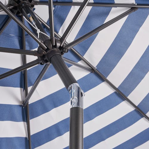 Close-up of the push-tilt on the pole of the 9-foot patio umbrella.