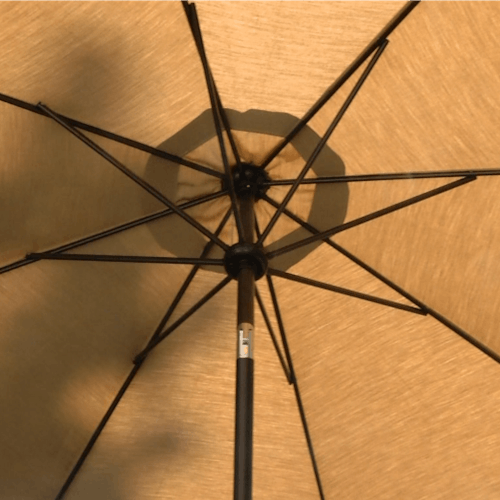 Close-up of the underside of the 9-foot tan patio umbrella.