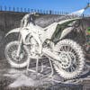 Dirt bike being cleaned with Slick Products Off-Road Extra Thick Foaming Cleaning Solution.