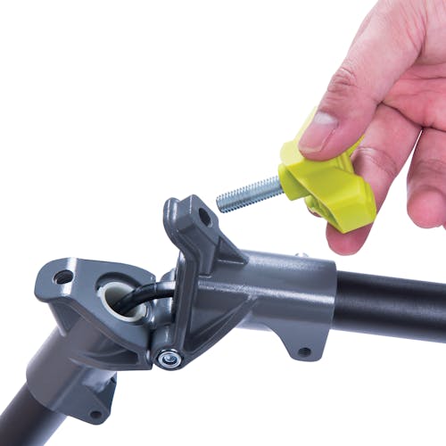 Close-up of someone screwing in a knob to connect the pole of the Sun Joe 100-volt 16-inch Cordless Brushless String Trimmer.