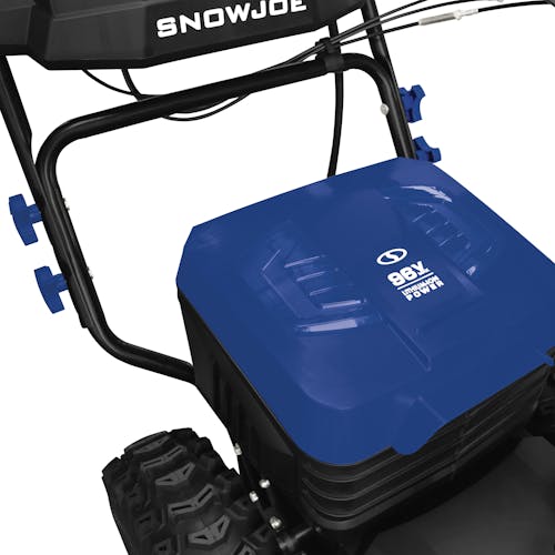 Close-up of the closed battery compartment on the Snow Joe 96-volt cordless 24-inch snow blower.