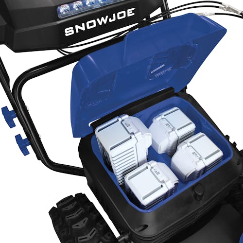 Close-up of the battery compartment for the Snow Joe 96-volt cordless 24-inch snow blower with four 12.0-Ah lithium-ion batteries inside.